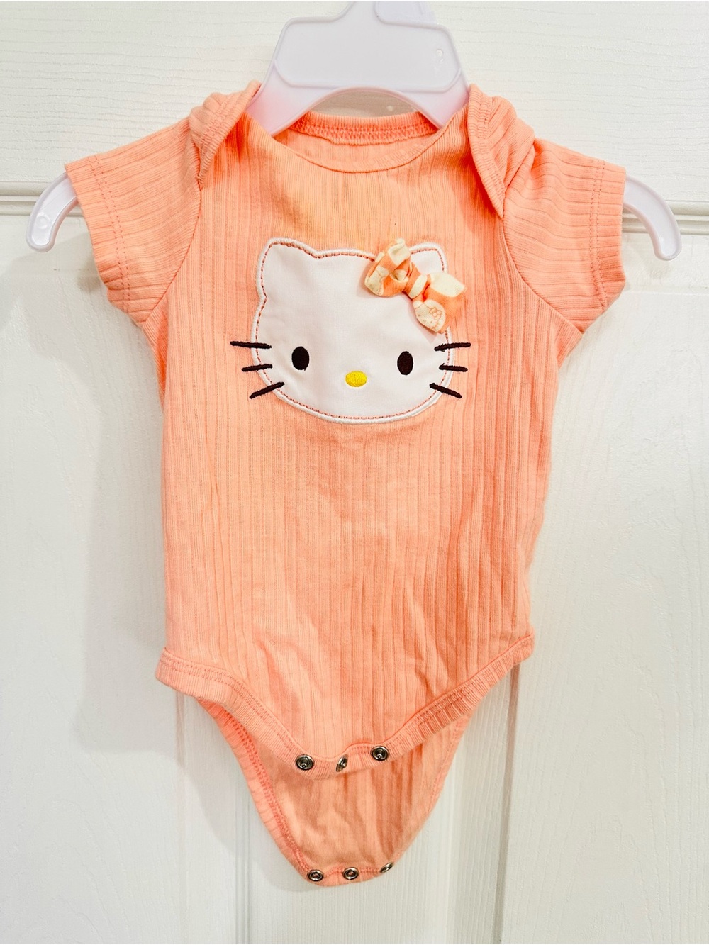 Hello Kitty Peach Ribbed Baby Bodysuit